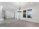 Bright dining room features hardwood floors and a modern chandelier at 5923 N 83Rd Ln, Glendale, AZ 85305