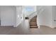 Modern open staircase with carpeted steps and white railings at 5923 N 83Rd Ln, Glendale, AZ 85305