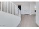 Elegant curved staircase with white railing at 5923 N 83Rd Ln, Glendale, AZ 85305