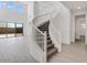 Elegant curved staircase with a modern, white railing at 5923 N 83Rd Ln, Glendale, AZ 85305