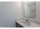 Modern powder room featuring a stylish vanity with quartz countertop and contemporary fixture at 2130 E Turney Ave # 4, Phoenix, AZ 85016