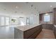 Modern kitchen with a large island, stainless steel appliances, and hardwood floors at 2130 E Turney Ave # 4, Phoenix, AZ 85016
