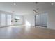 Bright, airy living room featuring light hardwood floors and a modern light fixture at 2130 E Turney Ave # 4, Phoenix, AZ 85016