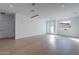 Spacious living room showcasing hardwood floors, recessed lighting, and large windows at 2130 E Turney Ave # 4, Phoenix, AZ 85016