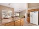 Open kitchen with island and dining area showcases seamless flow into the living area at 15284 W Cottonwood St, Surprise, AZ 85374