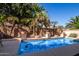 A refreshing private pool surrounded by lush tropical landscaping and desert landscape at 15284 W Cottonwood St, Surprise, AZ 85374