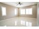 Bright bedroom with tile floors, recessed lighting, and white shuttered windows at 1800 N 156Th Dr, Goodyear, AZ 85395