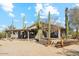 Desert landscape surrounds this single-story home with covered patio at 30120 N 70Th St, Scottsdale, AZ 85266