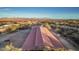 Aerial view showcasing a barn and expansive desert landscape at 15339 E Red Bird Rd, Scottsdale, AZ 85262