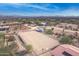 Aerial view of a property with a riding arena and horse trailer at 15339 E Red Bird Rd, Scottsdale, AZ 85262