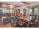 Rustic dining area with wooden table and chairs, adjacent to the kitchen at 15339 E Red Bird Rd, Scottsdale, AZ 85262