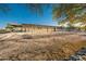 Equestrian facility with metal fencing and shaded overhang for horses at 15339 E Red Bird Rd, Scottsdale, AZ 85262