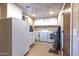 Convenient laundry room with washer, dryer, and extra storage at 15339 E Red Bird Rd, Scottsdale, AZ 85262