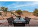 Fully fenced backyard with patio, play structure, and dining space at 22004 W Moonlight Path, Buckeye, AZ 85326