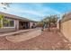 Spacious backyard with patio, mature tree, and playset with slide at 22004 W Moonlight Path, Buckeye, AZ 85326
