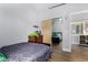 Cozy bedroom featuring hardwood floors and a mirrored closet at 22004 W Moonlight Path, Buckeye, AZ 85326