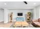 Bright living room with a large patterned rug, modern furnishings, and a ceiling fan at 22004 W Moonlight Path, Buckeye, AZ 85326