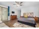 Spacious main bedroom with hardwood floors, walk-out patio, and natural light at 22004 W Moonlight Path, Buckeye, AZ 85326
