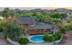An aerial view of a beautiful home with a private pool, mature trees, and a spacious backyard at 10647 N 82Nd Pl, Scottsdale, AZ 85260