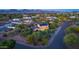 An aerial view showcasing this spacious two-story home with solar panels and well-maintained landscaping at 10647 N 82Nd Pl, Scottsdale, AZ 85260