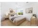 Inviting bedroom with a comfortable bed, stylish decor, and ample natural light from the window at 10647 N 82Nd Pl, Scottsdale, AZ 85260