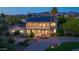 A beautiful exterior showcasing a two-story home with balcony, solar panels, and lush landscaping at 10647 N 82Nd Pl, Scottsdale, AZ 85260
