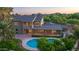A beautiful rear exterior showcasing a private pool and patio, complete with a slide and lush landscaping at 10647 N 82Nd Pl, Scottsdale, AZ 85260