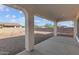 Covered patio area with stone columns perfect for outdoor entertaining and relaxation at 12308 W Parkway Ln, Avondale, AZ 85323