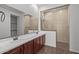 Bathroom boasting double sinks, modern fixtures, and a spacious walk-in shower at 12308 W Parkway Ln, Avondale, AZ 85323