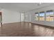 Spacious living room with lots of natural light, tile floors and adjoining kitchen at 12308 W Parkway Ln, Avondale, AZ 85323