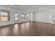 Bright living area featuring tile floors, multiple windows for natural light, and glass door at 12308 W Parkway Ln, Avondale, AZ 85323