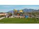 Alamar's colorful playground and picnic area with shaded seating and majestic mountain backdrop at 12308 W Parkway Ln, Avondale, AZ 85323