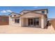 Spacious backyard featuring a covered patio and ample space for entertaining and recreation at 18711 E Panchito Dr, Gold Canyon, AZ 85118
