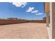 Backyard with low brick wall and view of houses at 18711 E Panchito Dr, Gold Canyon, AZ 85118