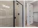 Modern bathroom boasting a glass-enclosed shower with tile walls and a connected toilet room at 18711 E Panchito Dr, Gold Canyon, AZ 85118