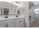 Modern bathroom with a double sink vanity, updated fixtures, and a combined tub and shower at 18711 E Panchito Dr, Gold Canyon, AZ 85118