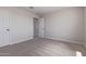 A well-lit bedroom featuring two entry doors and soft neutral carpeting for comfortable living at 18711 E Panchito Dr, Gold Canyon, AZ 85118