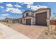 Beautiful two-story home with a three-car garage and manicured front yard at 18711 E Panchito Dr, Gold Canyon, AZ 85118
