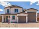Attractive two-story home with a three-car garage, showcasing modern design at 18711 E Panchito Dr, Gold Canyon, AZ 85118