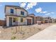Inviting two-story home with a three-car garage and a well-manicured front yard at 18711 E Panchito Dr, Gold Canyon, AZ 85118