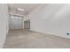 A garage with high ceilings, lights, and two doors with a concrete floor at 18711 E Panchito Dr, Gold Canyon, AZ 85118