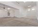 Spacious two car garage with a water heater, multiple light fixtures, and large doors at 18711 E Panchito Dr, Gold Canyon, AZ 85118