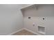 Small laundry room with hookups for laundry appliances and white shelves at 18711 E Panchito Dr, Gold Canyon, AZ 85118