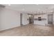 Open living space with tile floors adjacent to the kitchen, creating an inviting and spacious area at 18711 E Panchito Dr, Gold Canyon, AZ 85118