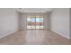 Open living area with tile flooring and a sliding door leading to the backyard at 18711 E Panchito Dr, Gold Canyon, AZ 85118