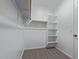 Walk-in closet with ample shelving and hanging space for organized storage solutions at 18711 E Panchito Dr, Gold Canyon, AZ 85118