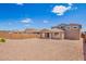 Large, unfinished backyard featuring a covered patio and block wall, offering privacy and space at 18746 E Panchito Dr, Gold Canyon, AZ 85118