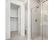 Modern bathroom with a glass-enclosed shower and a doorway to the closet at 18746 E Panchito Dr, Gold Canyon, AZ 85118