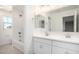Bright bathroom featuring a double vanity and tub with subway tile surround at 18746 E Panchito Dr, Gold Canyon, AZ 85118