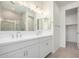 Bathroom with double sink vanity, a large mirror, and modern lighting at 18746 E Panchito Dr, Gold Canyon, AZ 85118